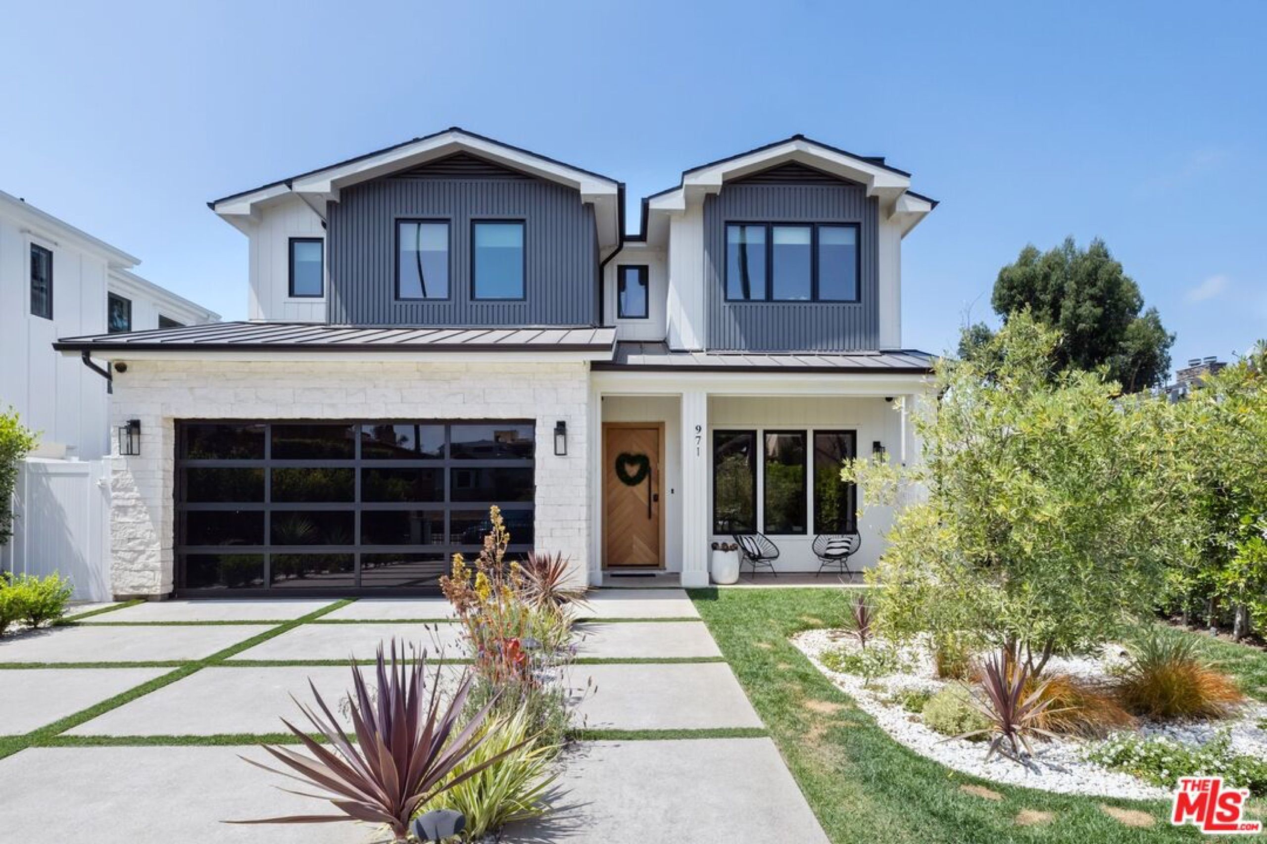 Modern farmhouse facade of 971 South Bundy Drive in Brentwood