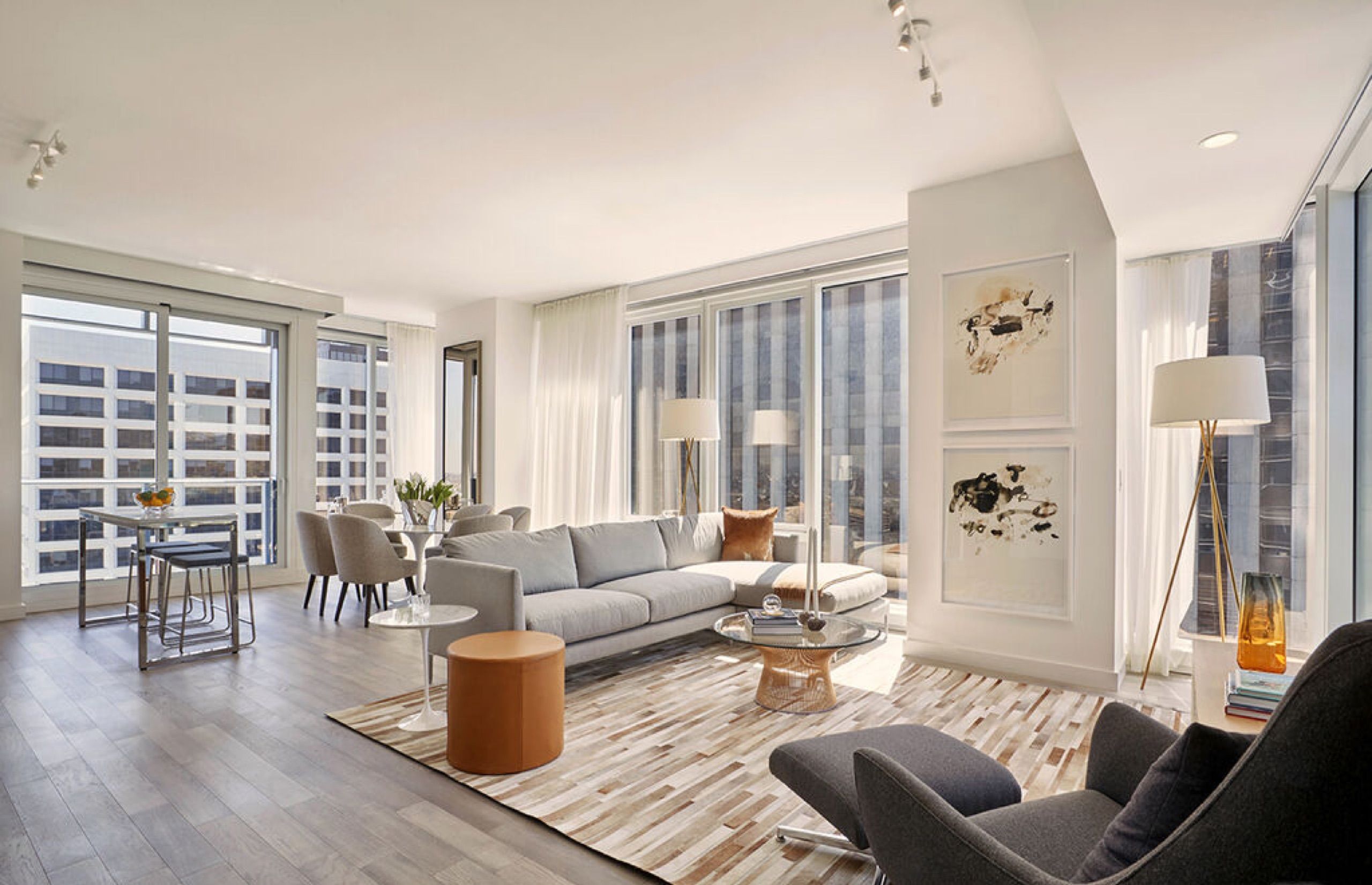 Living room with floor to ceiling windows at Ten Thousand, Century City