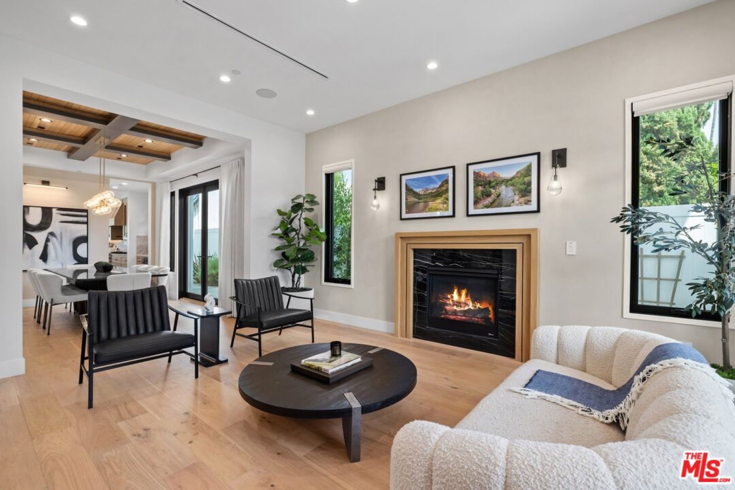 Living room with fireplace and coffered ceiling
