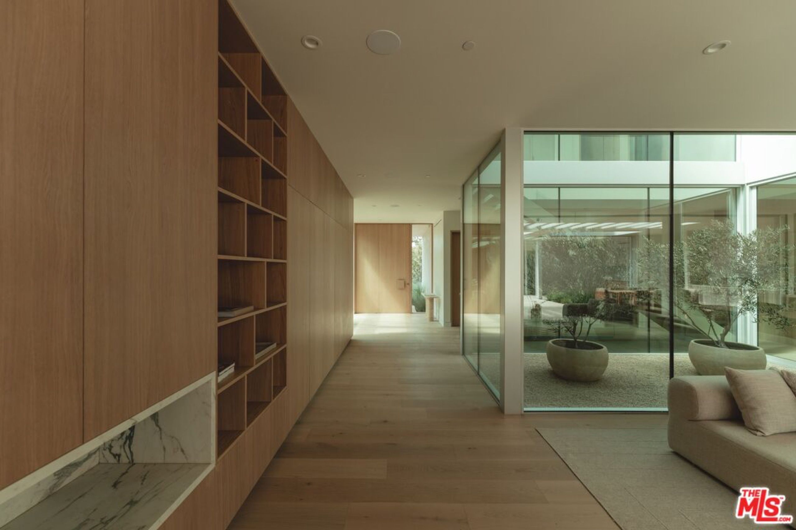 Gallery hallway with built in oak shelving