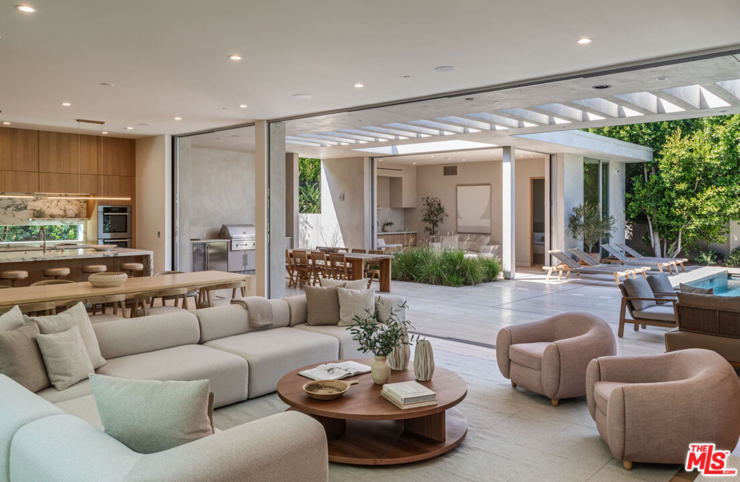 Living room opening onto the pool terrace at 634 Moreno Avenue