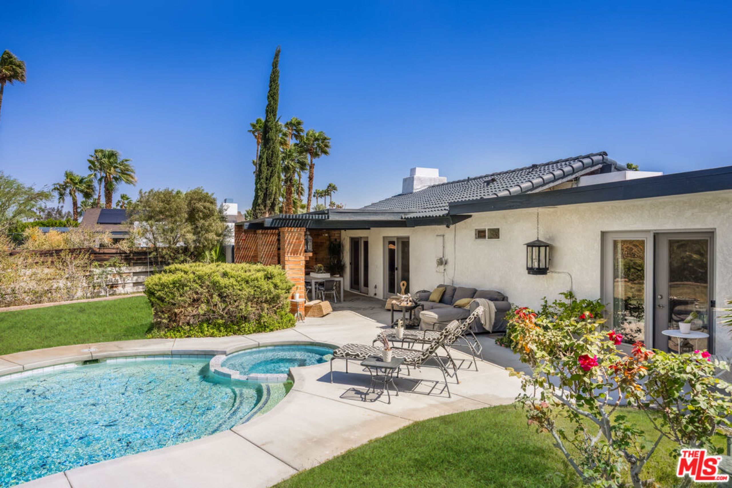 Rear of the house with pool and rose garden