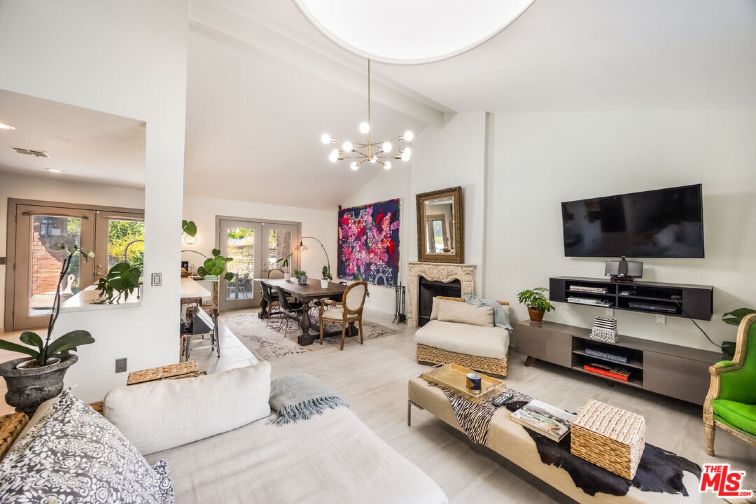 Living room with fireplace and French doors to the garden