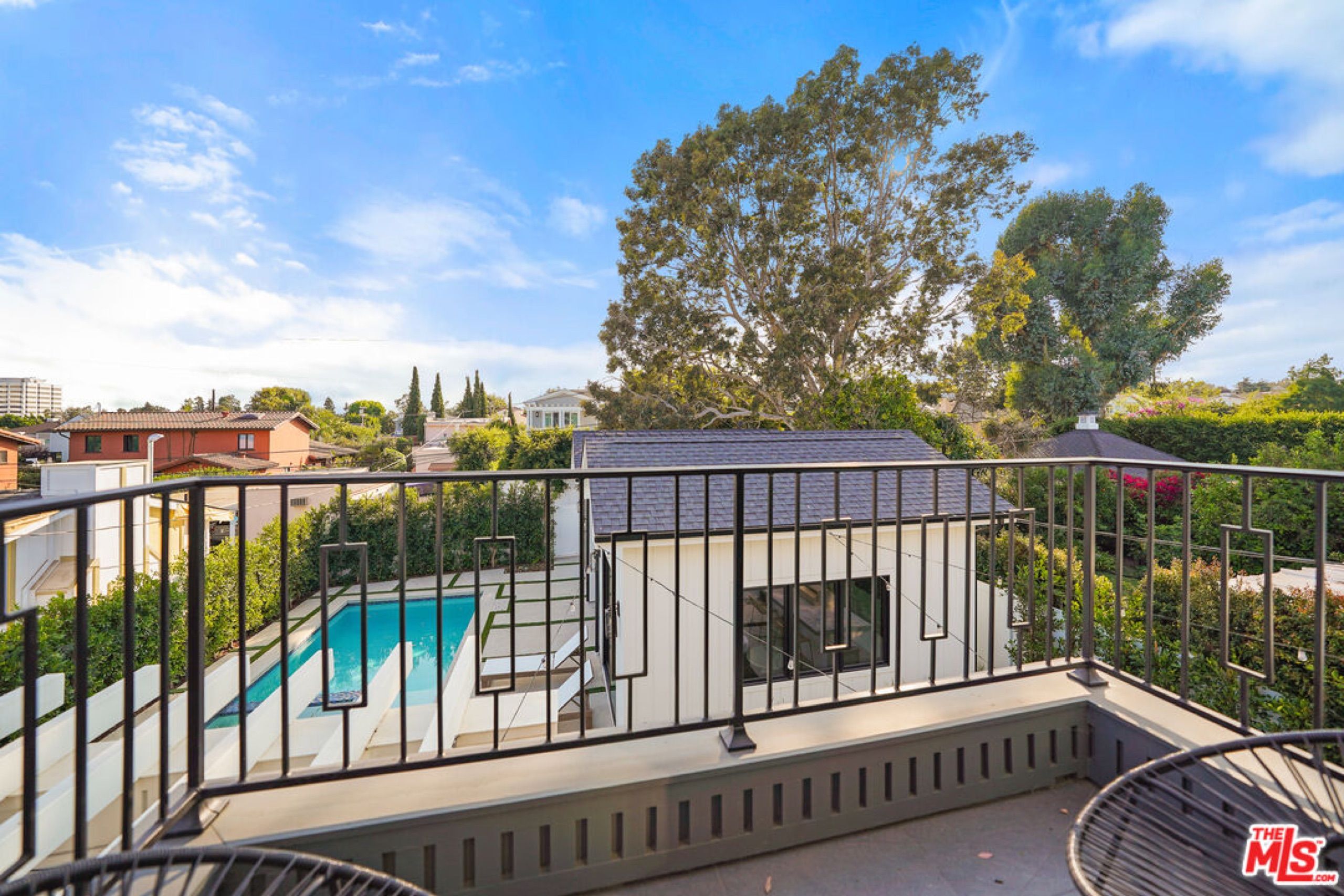Balcony view over the pool and guest house